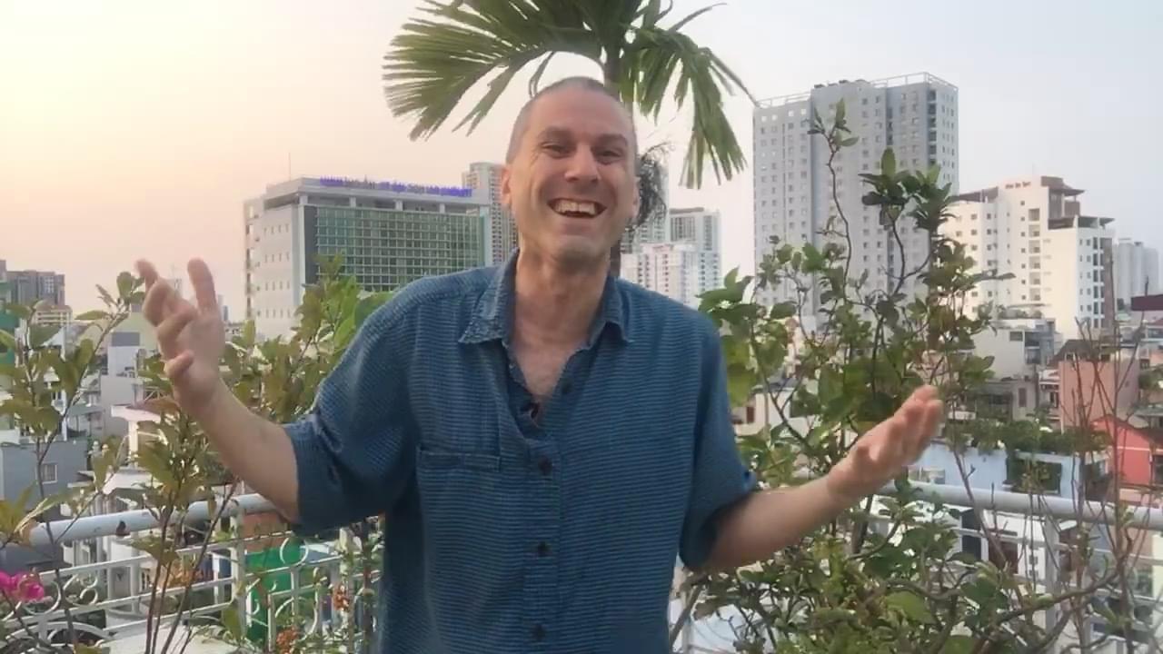Dave Berman films on a rooftop in Saigon, Vietnam